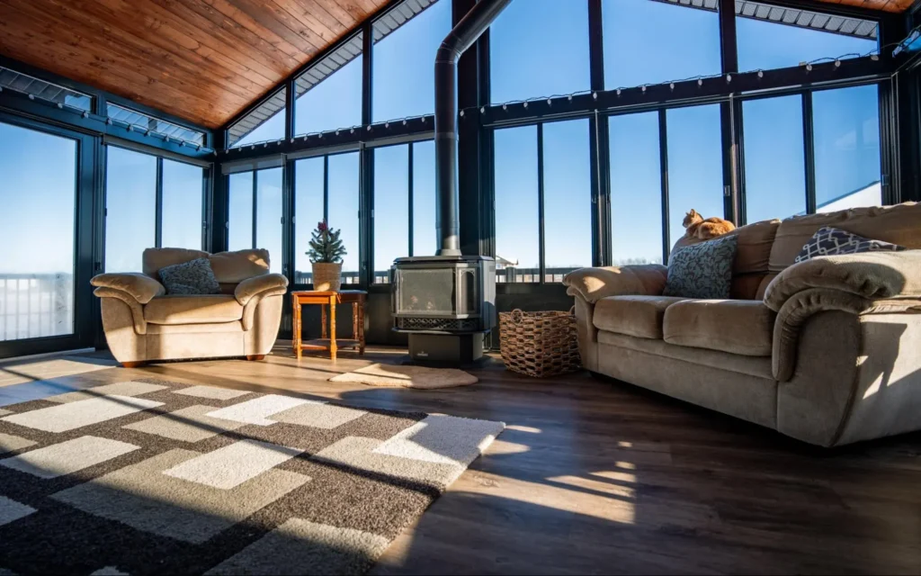 Modern room with tall windows and a lake view