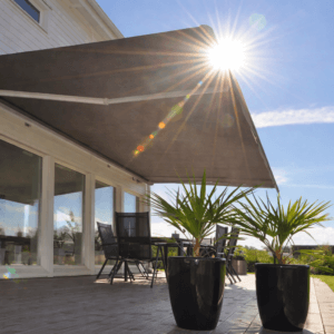 Sunlight filtered through extended awning over patio