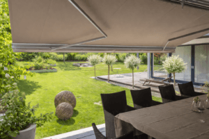 Shaded outdoor lounge beneath retractable awning