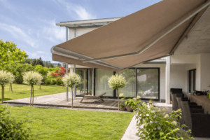 Awning extended along house façade for sun protection