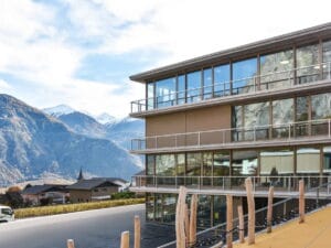 Vertical drop awning shading balcony with mountain view