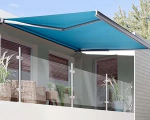 Blue fabric awning installed on modern balcony