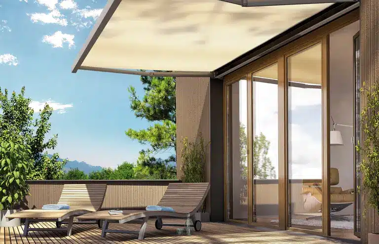 Awning shading outdoor seating near sliding doors