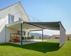 Outdoor terrace with awning at sunset