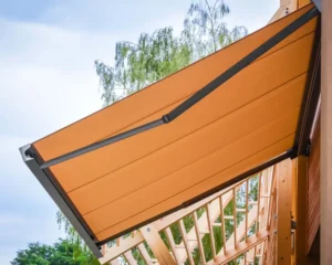 Angled awning providing shade on outdoor space