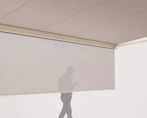 Vertical drop screen partially lowered for sun protection