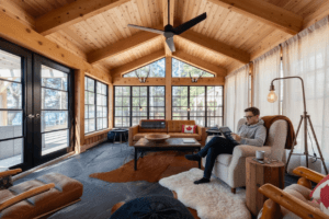 Sunroom with black-framed windows and vaulted ceiling
