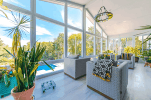 Bright sunroom with panoramic windows and modern seating