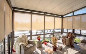 Four-season sunroom with panoramic glazing and wood ceiling