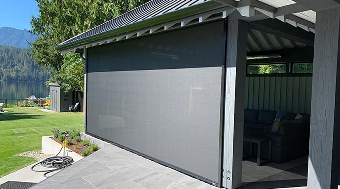Vertical drop screen installed on modern pergola