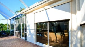 Motorized screen covering large glass façade
