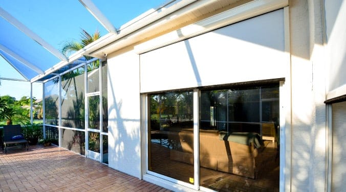 Motorized screen covering large glass façade