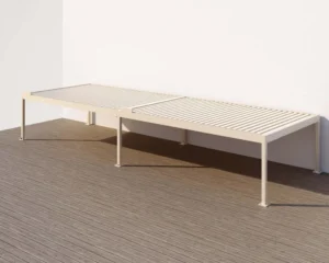 Outdoor lounger placed under a hardtop pergola