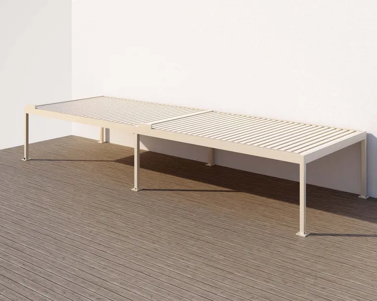 Outdoor lounger placed under a hardtop pergola