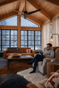 Sunroom with black-framed windows and vaulted ceiling