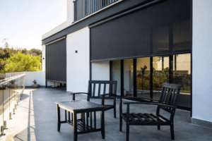 Patio seating area with vertical zip screens fully lowered
