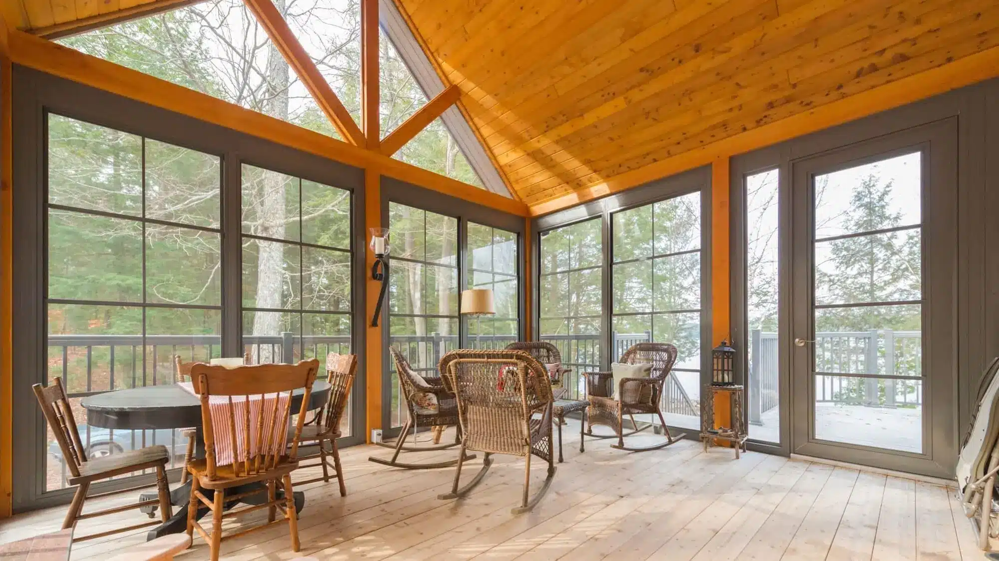 Sunroom with solid wood ceiling and outdoor dining area