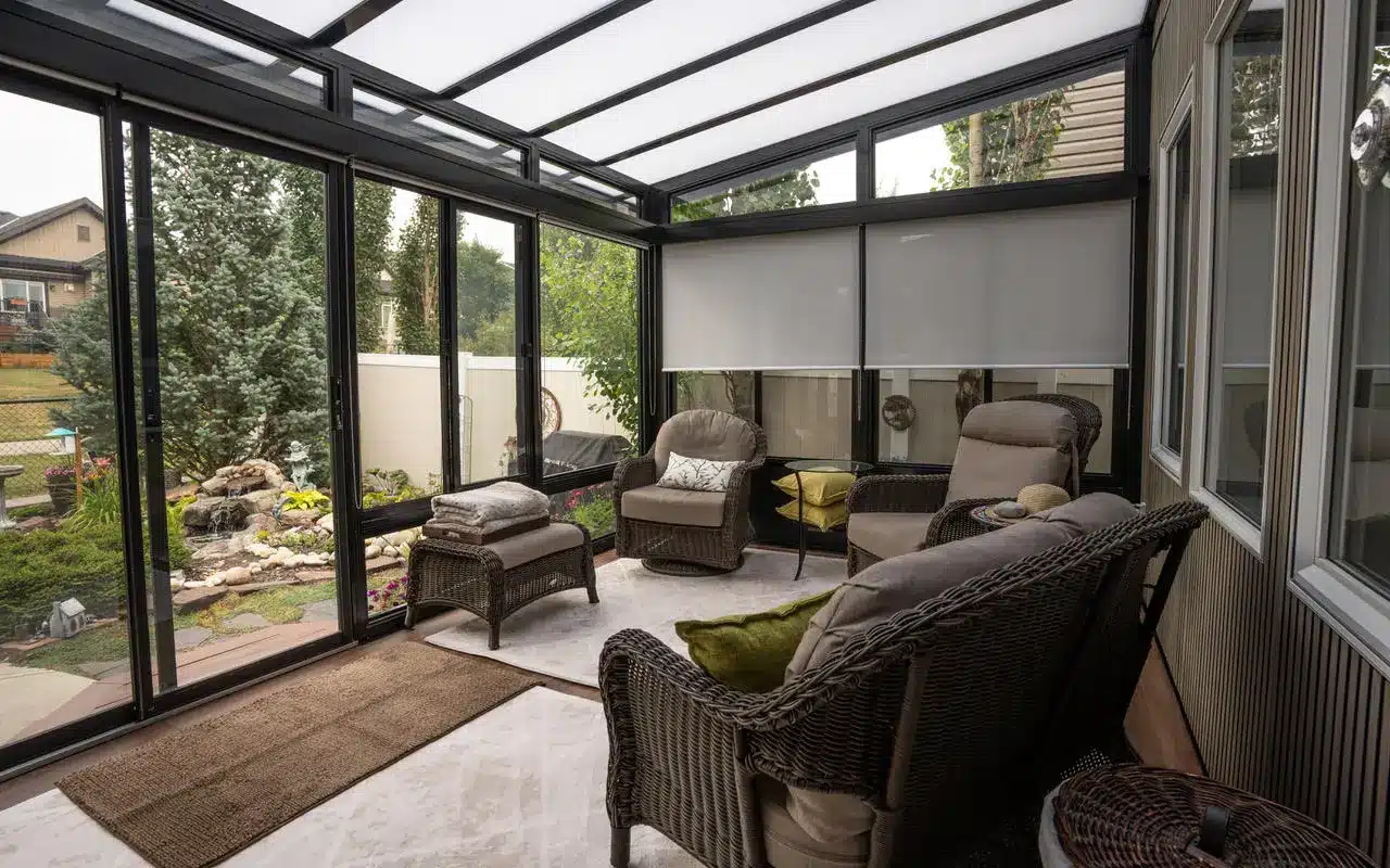 Enclosed sunroom with outdoor seating and glass roof