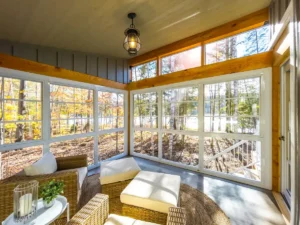 Three-season sunroom with wood ceiling and panoramic windows