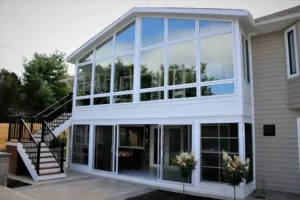 Two-story glass sunroom home addition
