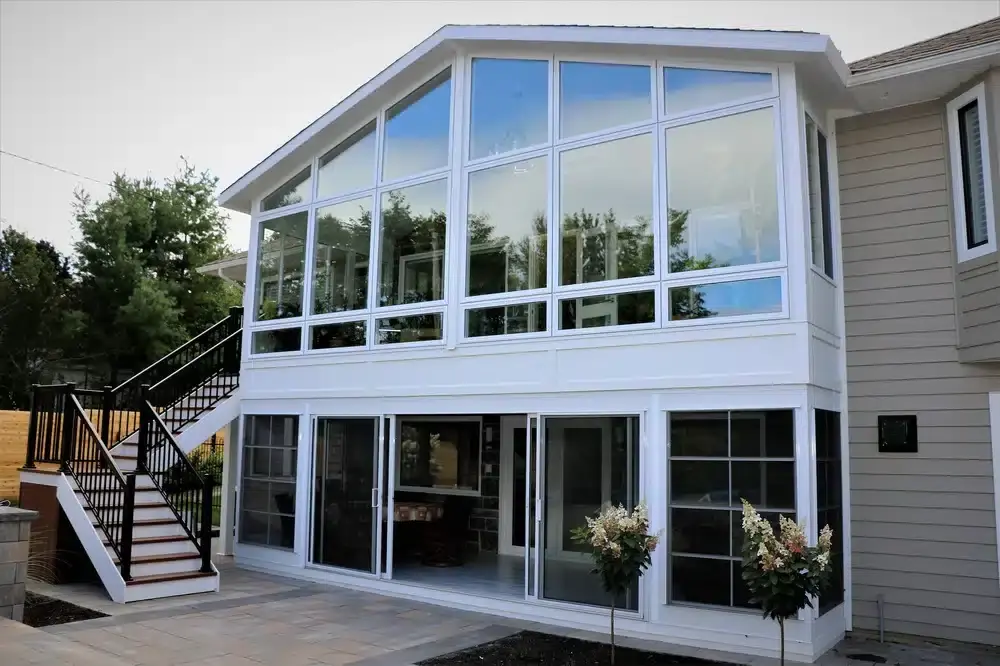 Two-story glass sunroom home addition