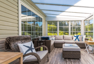 Comfortable screened sunroom with wicker furniture and natural light